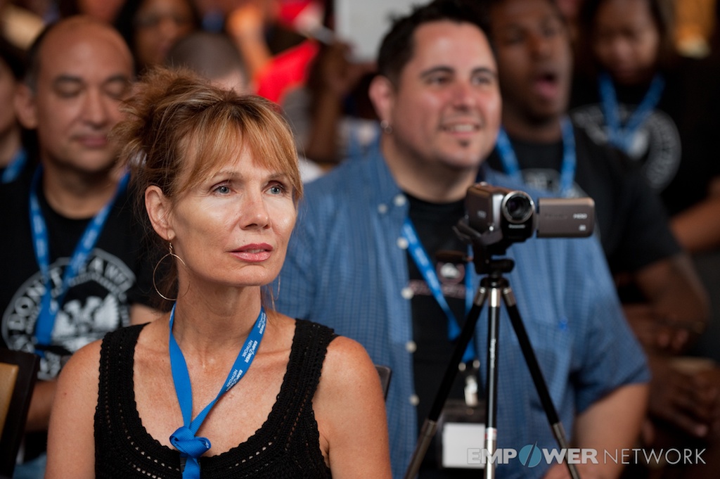 Audience members at an Empower Network event, listening