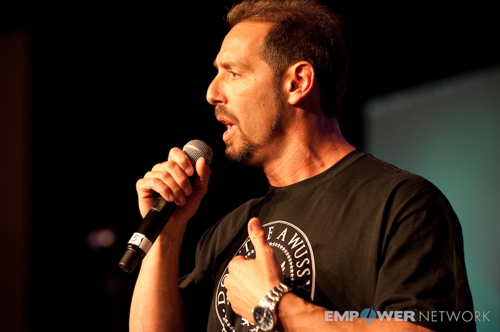 Close-up of a speaker delivering an intense, heartfelt message on stage at Empower Network's 2012 Atlanta event