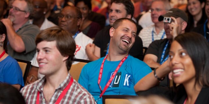 Audience members bursting into laughter during a session at Empower Network's 2012 Atlanta event