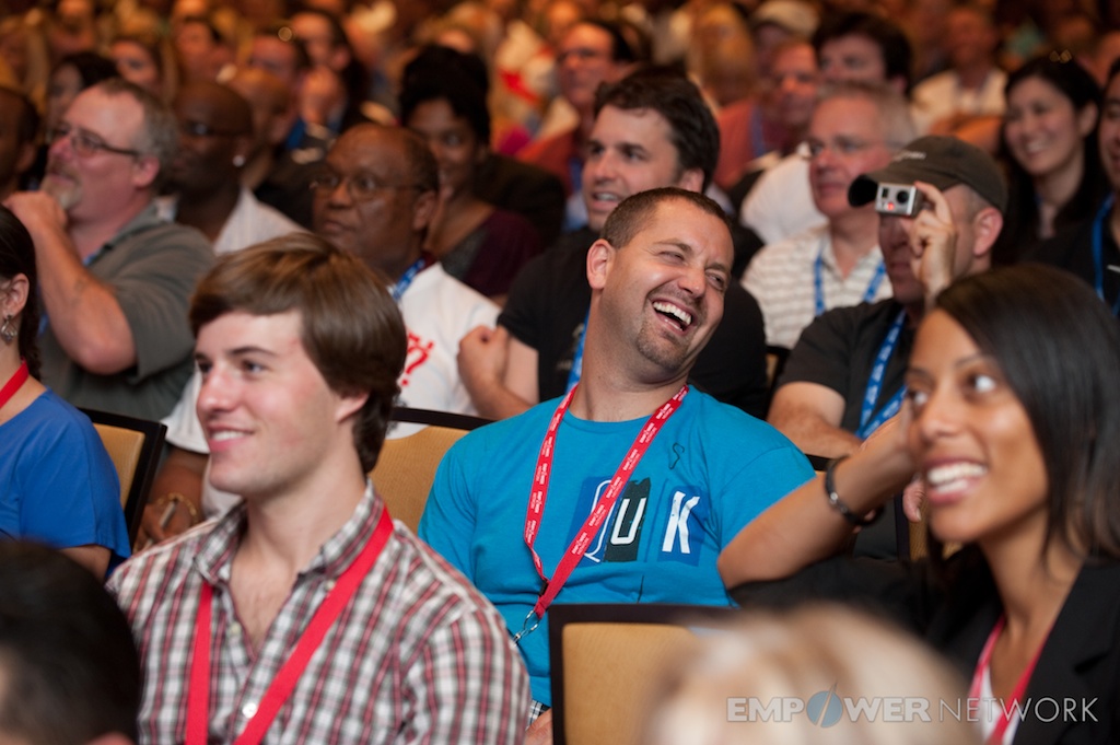 Audience members bursting into laughter during a session at Empower Network's 2012 Atlanta event