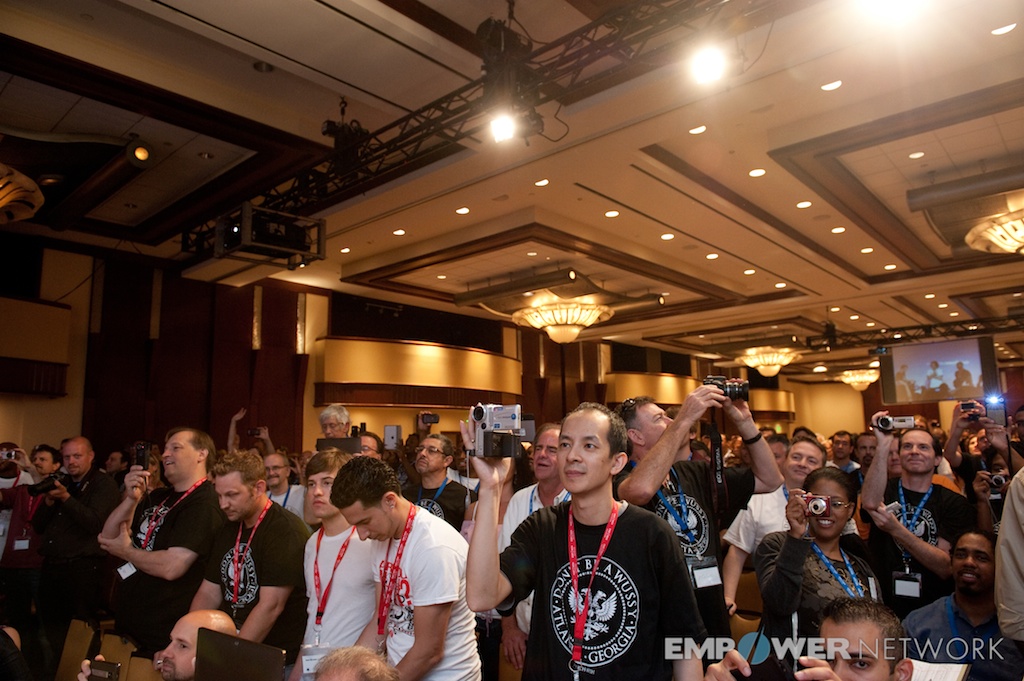 Attendees on their feet capturing the stage with cameras and phones at Empower Network's 2012 Atlanta event