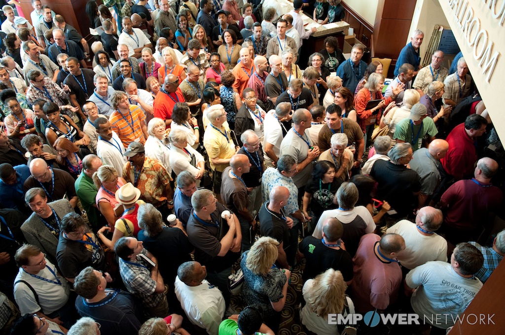 Overhead view of a huge crowd of attendees mingling outside the ballroom at Empower Network's 2012 Atlanta event