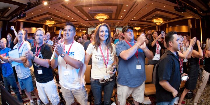 Crowd on its feet applauding in the grand ballroom at Empower Network's 2012 Atlanta event