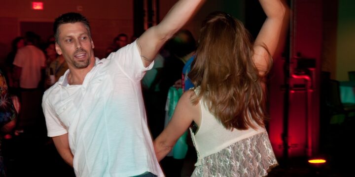 Couple dancing together at an evening party during Empower Network's 2012 Atlanta event